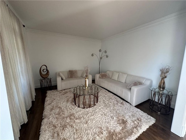 living area featuring baseboards, dark wood finished floors, and crown molding