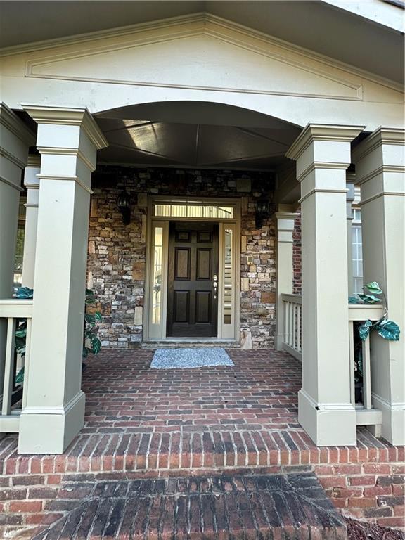 view of exterior entry with stone siding