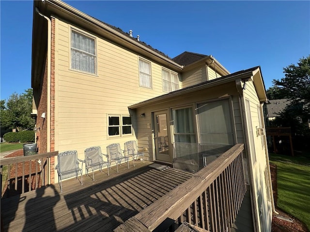 back of property with a wooden deck