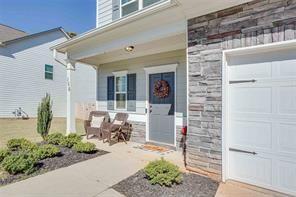 view of exterior entry with a garage