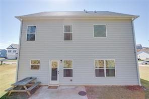 back of house with a patio area