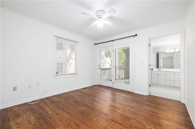 empty room with ceiling fan, ornamental molding, and dark hardwood / wood-style flooring