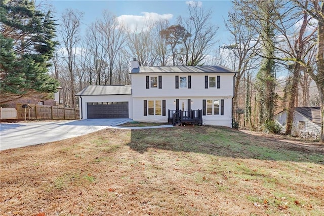 view of front facade featuring a garage and a front lawn