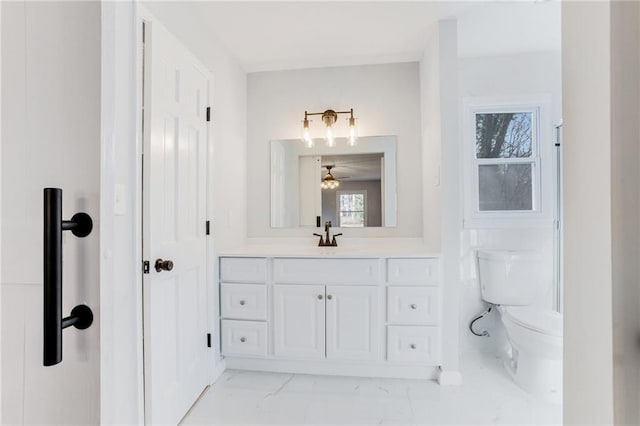 bathroom with vanity and toilet