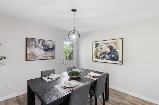 389 Oglesby Bridge Rd SE, Conyers, GA 30094 - dining space featuring wood finished floors and baseboards