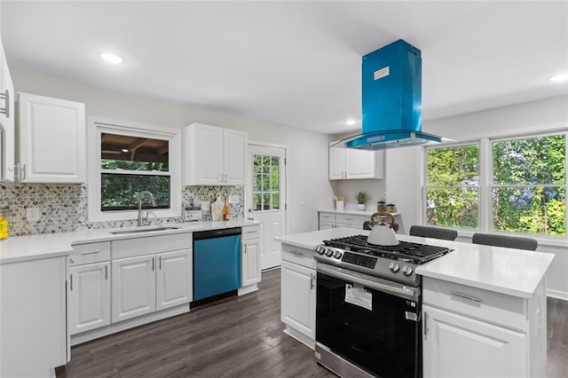 389 Oglesby Bridge Rd SE, Conyers, GA 30094 - kitchen with dishwashing machine, gas stove, a sink, island exhaust hood, and dark wood finished floors