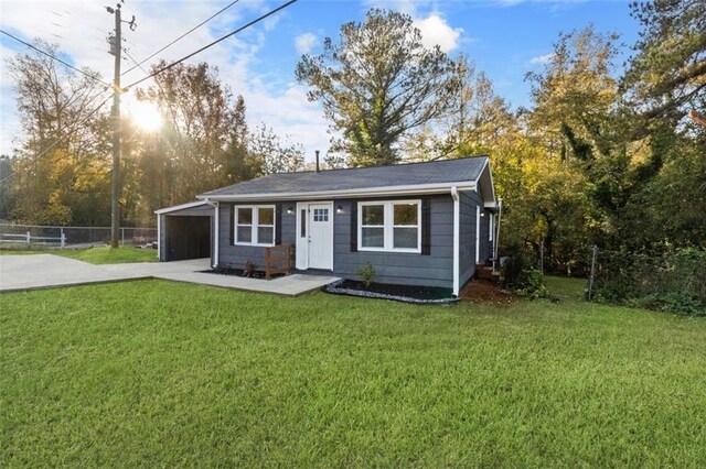 389 Oglesby Bridge Rd SE, Conyers, GA 30094 - view of front of house featuring driveway, a front lawn, and an attached garage