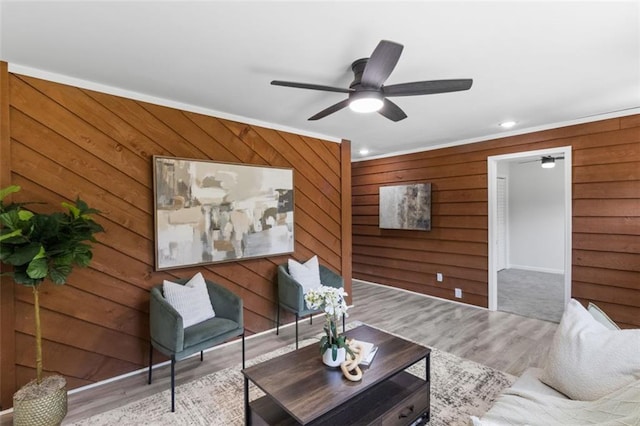 389 Oglesby Bridge Rd SE, Conyers, GA 30094 - living area with wood walls, ceiling fan, wood finished floors, recessed lighting, and crown molding