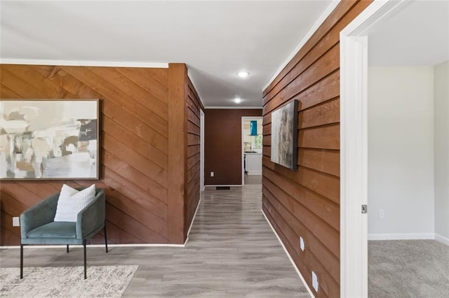 389 Oglesby Bridge Rd SE, Conyers, GA 30094 - hall with wooden walls, baseboards, recessed lighting, light wood-style floors, and ornamental molding