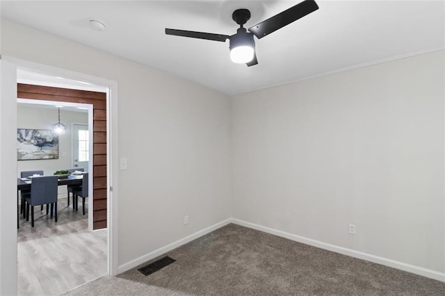 389 Oglesby Bridge Rd SE, Conyers, GA 30094 - spare room featuring ceiling fan, baseboards, carpet, and a smoke detector