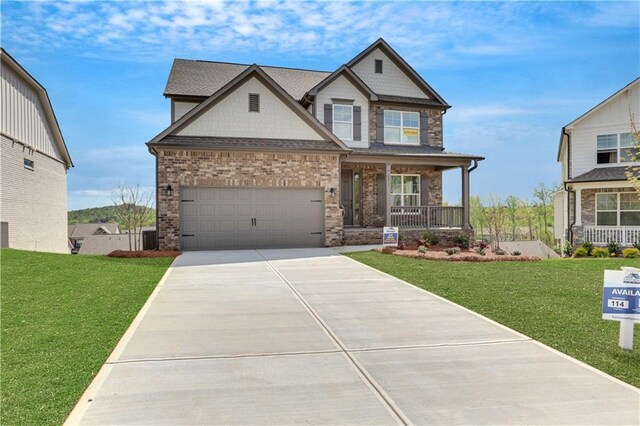 6811 Cambridge Dr, Flowery Branch, GA 30542 - craftsman-style house with a balcony, a front lawn, and a garage