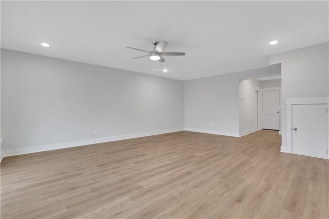 unfurnished room featuring ceiling fan and light hardwood / wood-style flooring