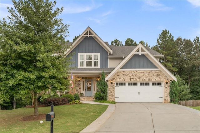 craftsman inspired home with a front yard and a garage