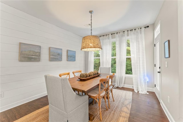 dining area featuring dark hardwood / wood-style floors