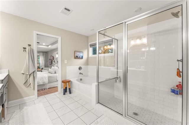 bathroom with vanity, tile patterned flooring, and separate shower and tub