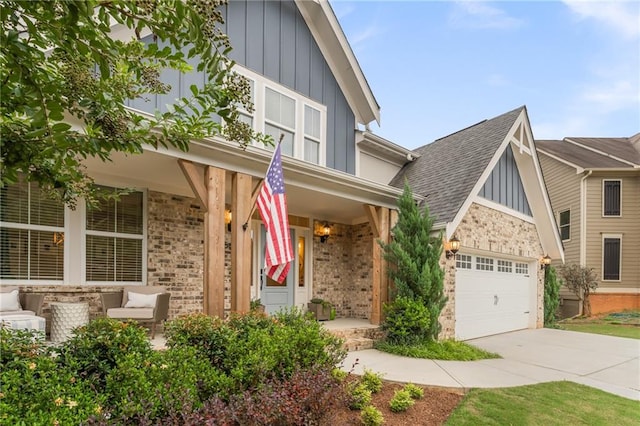 view of front of home featuring a porch and a garage