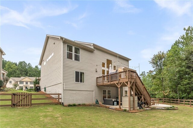 back of property with a patio area, a deck, and a lawn