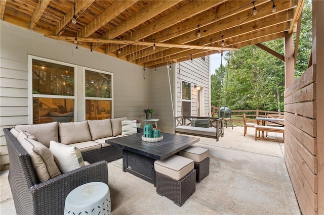 view of patio with area for grilling and an outdoor hangout area