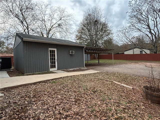 view of outbuilding with a carport and central air condition unit