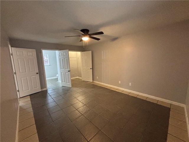 spare room featuring ceiling fan