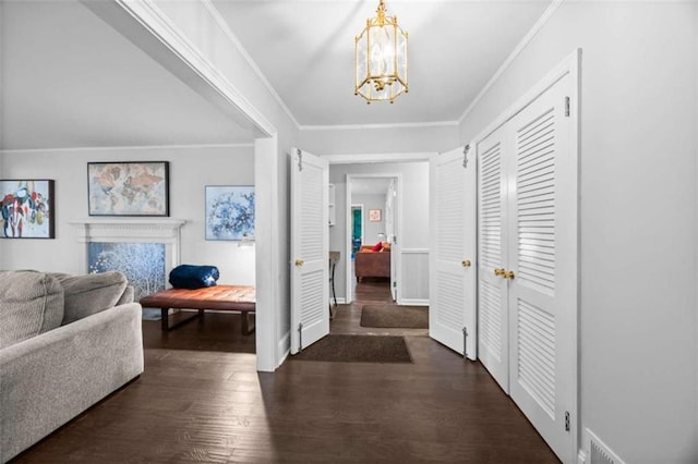 200 Mcguirts Bridge Rd, Covington, GA 30014 - foyer entrance with a chandelier, wood finished floors, crown molding, and baseboards