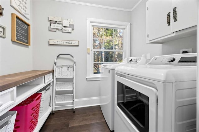 200 Mcguirts Bridge Rd, Covington, GA 30014 - washroom with separate washer and dryer, cabinet space, crown molding, dark wood finished floors, and baseboards