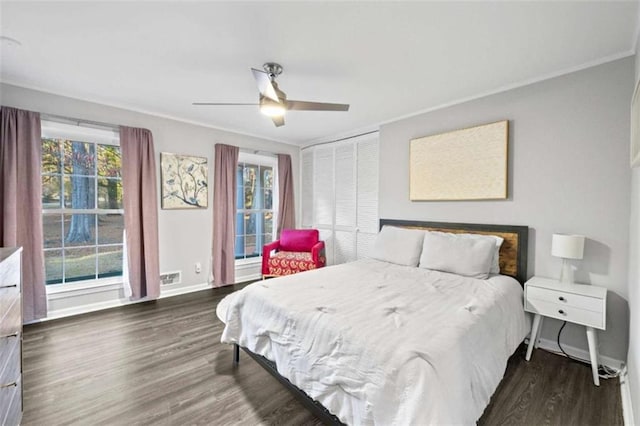 200 Mcguirts Bridge Rd, Covington, GA 30014 - bedroom with wood finished floors, ornamental molding, baseboards, a ceiling fan, and a closet