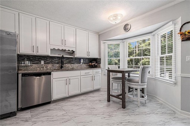 6492 Swift Creek Rd, Lithonia, GA 30058 - kitchen with stainless steel appliances, light marble finish flooring, healthy amount of natural light, ornamental molding, and a textured ceiling