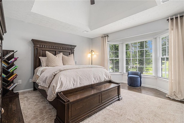 6492 Swift Creek Rd, Lithonia, GA 30058 - bedroom featuring a textured ceiling, wood finished floors, and a ceiling fan