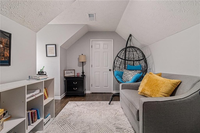 6492 Swift Creek Rd, Lithonia, GA 30058 - living area with wood finished floors, a textured ceiling, and vaulted ceiling