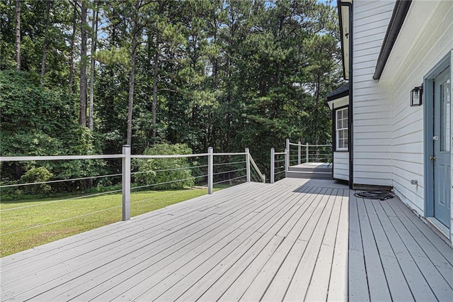 6492 Swift Creek Rd, Lithonia, GA 30058 - wooden terrace featuring a lawn and view of wooded area