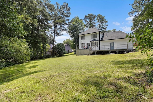 6492 Swift Creek Rd, Lithonia, GA 30058 - rear view of property with a deck and a lawn