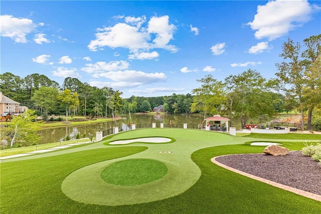 view of property's community featuring a gazebo, a water view, and a yard