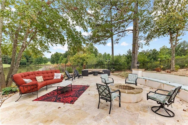 view of patio / terrace with an outdoor living space with a fire pit