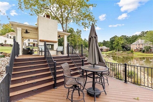 wooden deck featuring a water view