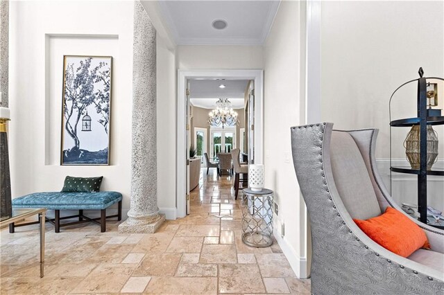 hall with crown molding and a chandelier