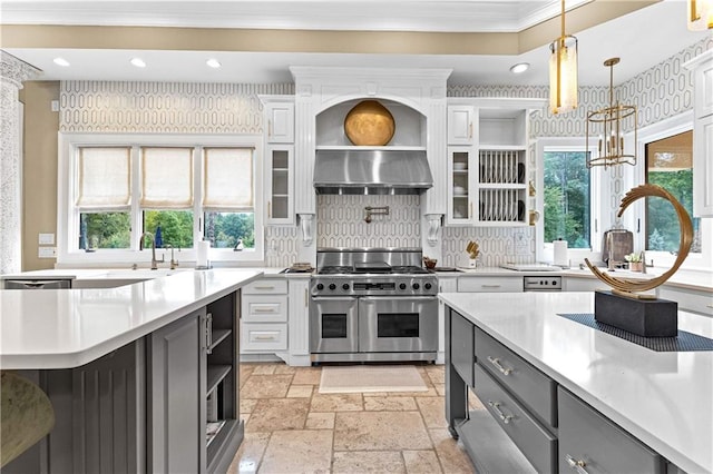 kitchen with range with two ovens, white cabinetry, and gray cabinets