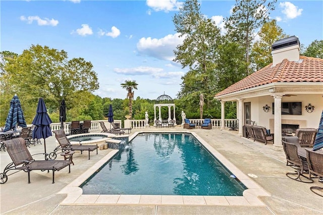 view of swimming pool featuring an in ground hot tub, a gazebo, and a patio area