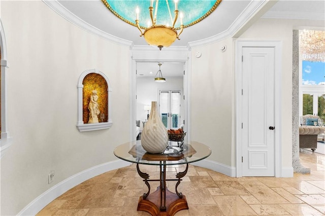 corridor with crown molding and a notable chandelier