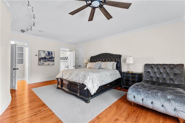 bedroom with crown molding, hardwood / wood-style floors, and ceiling fan