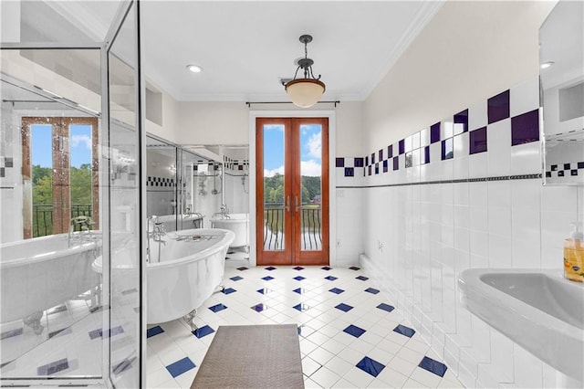 bathroom featuring separate shower and tub, french doors, tile walls, crown molding, and tile patterned flooring