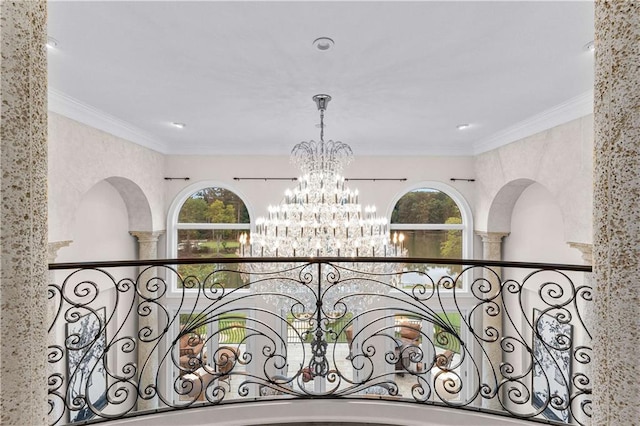 interior details with crown molding and a notable chandelier