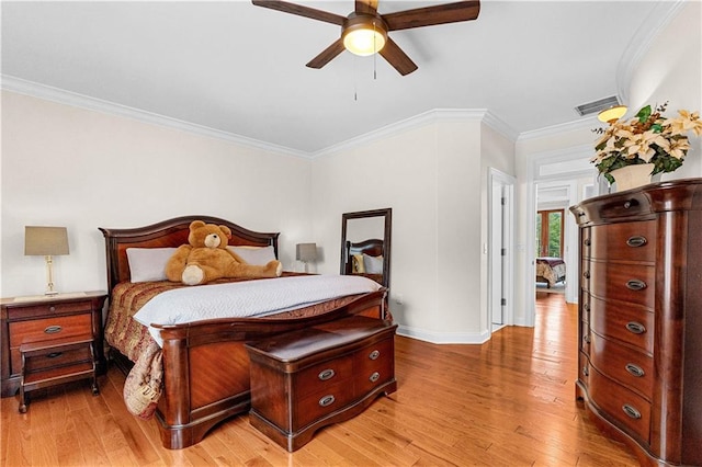 bedroom featuring ornamental molding, ceiling fan, and light hardwood / wood-style floors