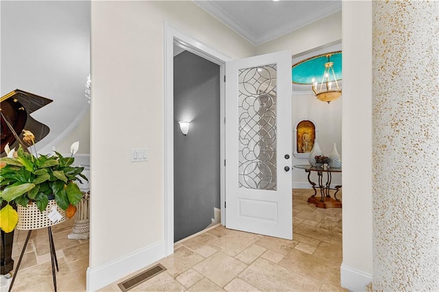 foyer featuring crown molding