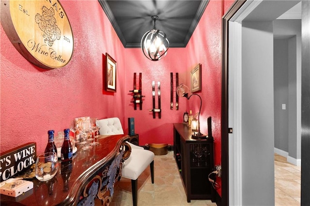 interior space featuring crown molding and an inviting chandelier