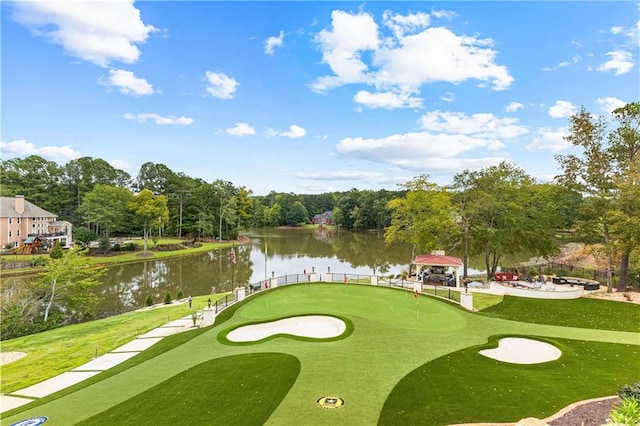 surrounding community with a gazebo, a yard, and a water view