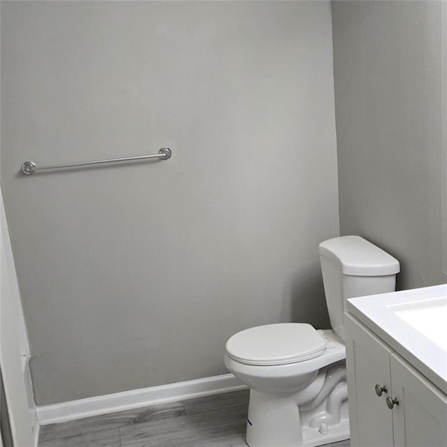 6354 Shannon Pkwy Unit 20D, Union City, GA 30291 - bathroom featuring toilet, baseboards, and vanity