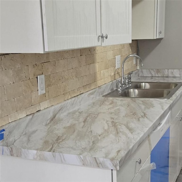 6354 Shannon Pkwy Unit 20D, Union City, GA 30291 - interior details with white cabinetry, light stone counters, decorative backsplash, and a sink