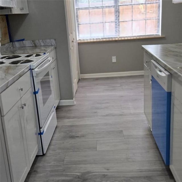 6354 Shannon Pkwy Unit 20D, Union City, GA 30291 - kitchen featuring dishwashing machine, baseboards, light wood-style flooring, white cabinets, and white range with electric stovetop