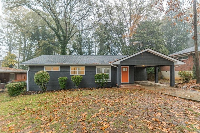 ranch-style home featuring a carport